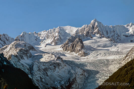 Alpine detail of the snow, ice, rocks  and shapes of massive mountains.