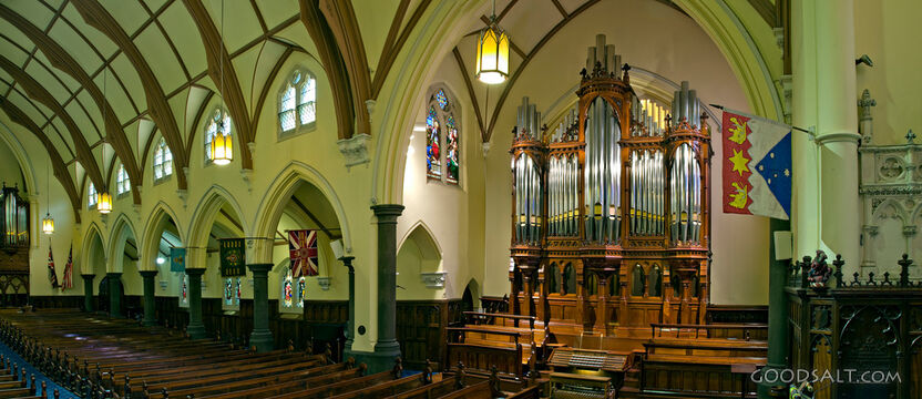 Church Interior With Seats and Pipe Organ