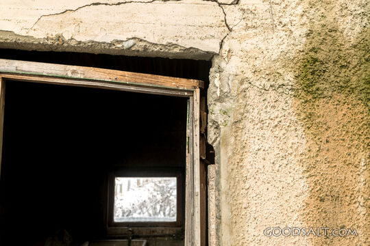 close-up of decayed window on old shed