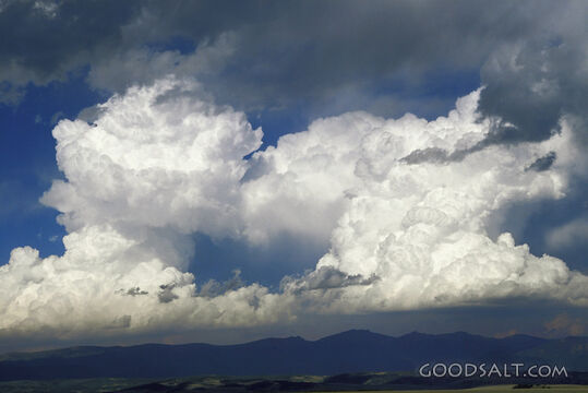 Cumulus Clouds in Dark Blue Sky