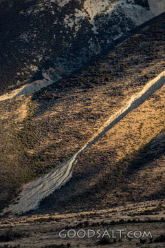 Detail of heavy rock erosion on steep mountainside.