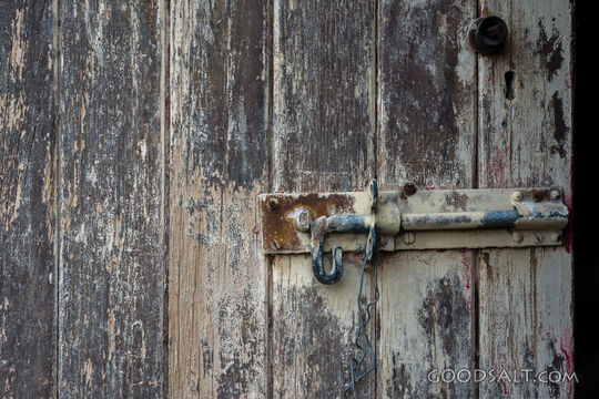 Door bolt on weathered door.