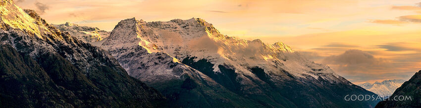 dramatic mountain range with snow and rock.