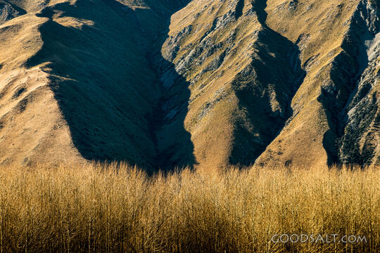 Eroded ridges on base of steep hillside.