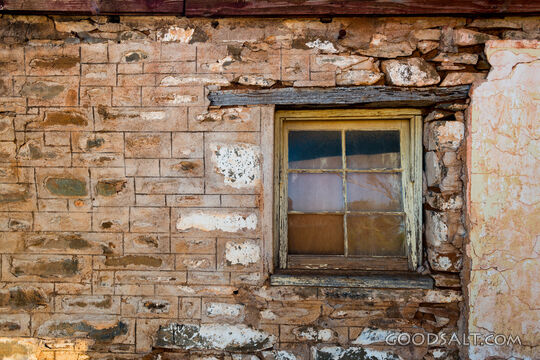 External window in stone house wall.