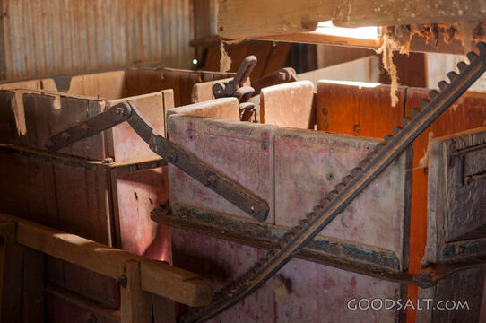 Historic wool baling machinery in old shed.