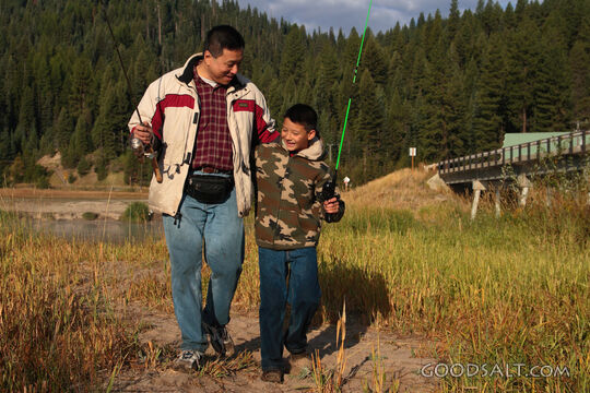 IDAHO. Smith’s Ferry. Man and boy fishing on autumn morning.