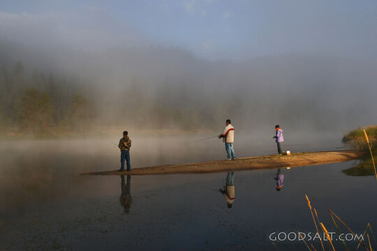IDAHO. Smith’s Ferry. Man and kids fishing on foggy morning.