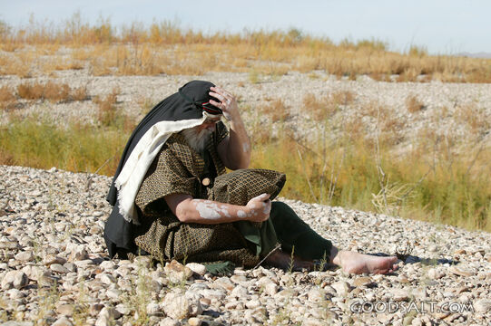 Isrealite Man Sits on Ground in Anguish