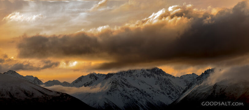 Late sunset and low clouds over range.