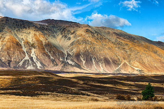 Low hills exhibit great variety of colour.