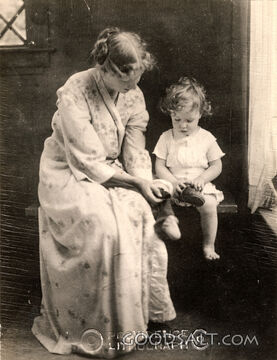 Mother Dressing Child