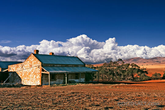 old stone house in field