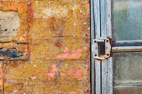 Old wire door and stone surrounds.