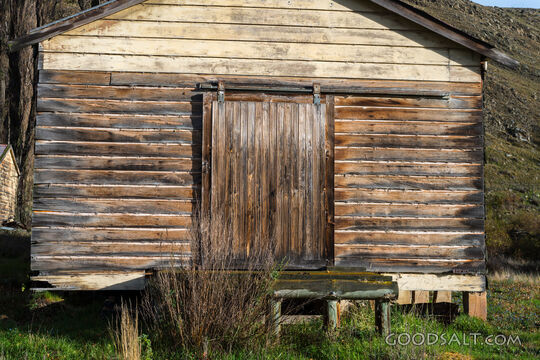 Old wooden shed and end door.