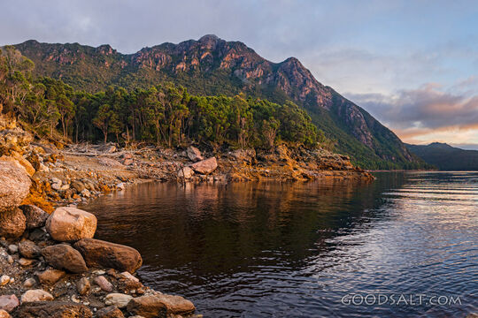 Perfect mirrored lake and shores at sunrise.