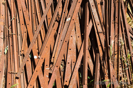 Pile of rusty fence posts.