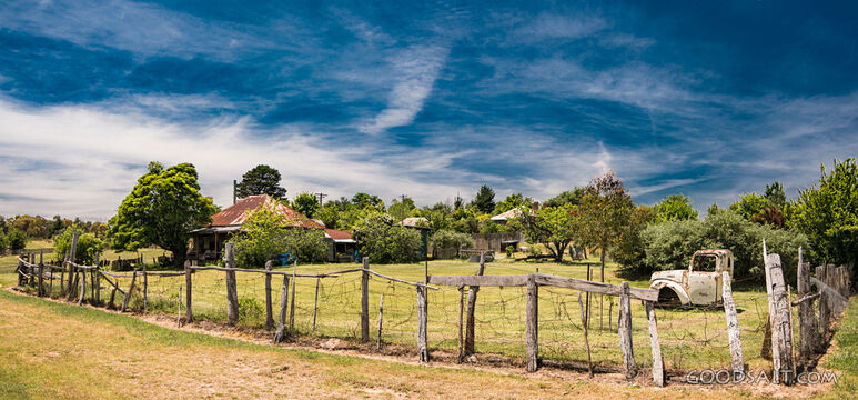 Pioneering residence with pickwt fence.