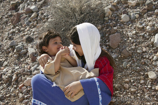 sister holding smaller child