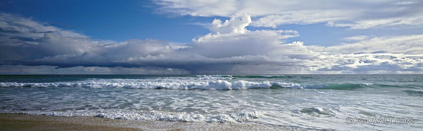Seascape With Frothy Waves and Puffy Clouds