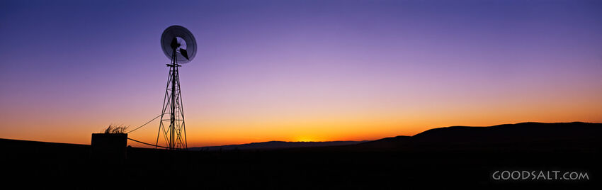 Silhouetted Windmill at Sunset