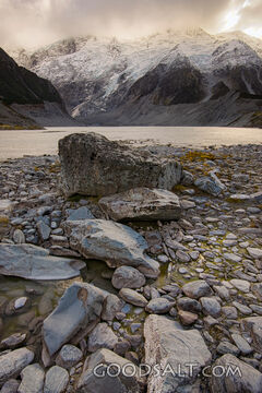 Spectacular alpine scenery of rocks, boulders, snow and water.