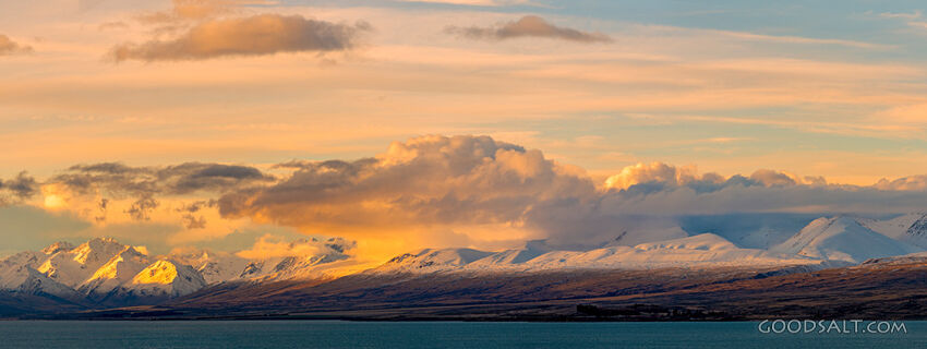 Spectacular sunset clouds and golden lit peaks.