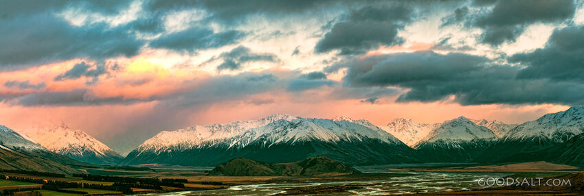 The light of the early sunrise collides with a mountainside.