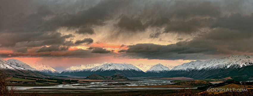 The light of the early sunrise collides with a mountainside.