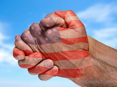 Two Hands Praying With American Flag