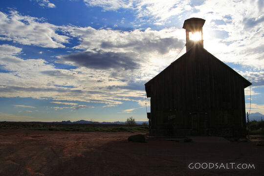 UTAH. Moab. Sun bursting through bell tower of old church at