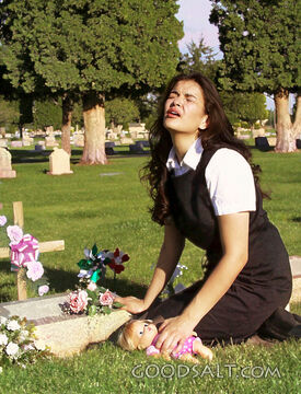 Woman Grieves at Gravesite