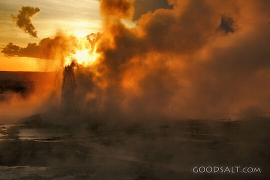 WYOMING. Yellowstone National Park. Sunset through Spasm Gey