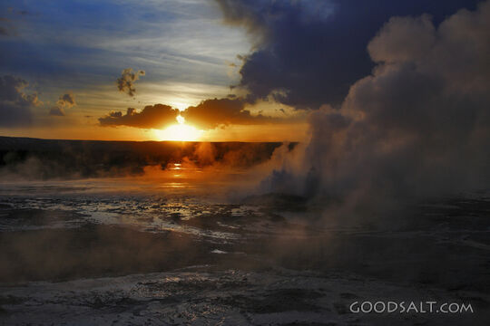 WYOMING. Yellowstone National Park. Sunset through Spasm Gey