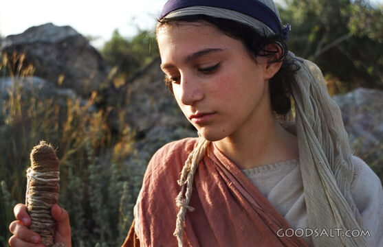 Young Person With Staff Looking Down
