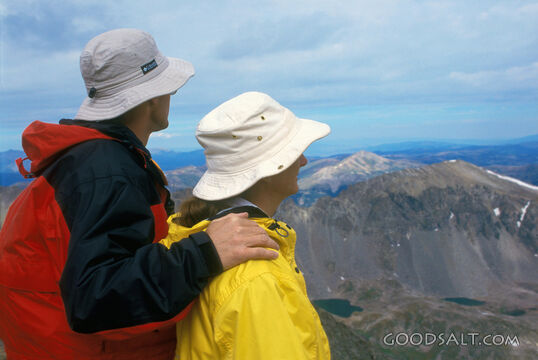 A Couple Looking Out Onto a Valley
