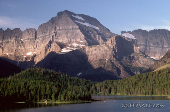 alpine lake below jagged peaks