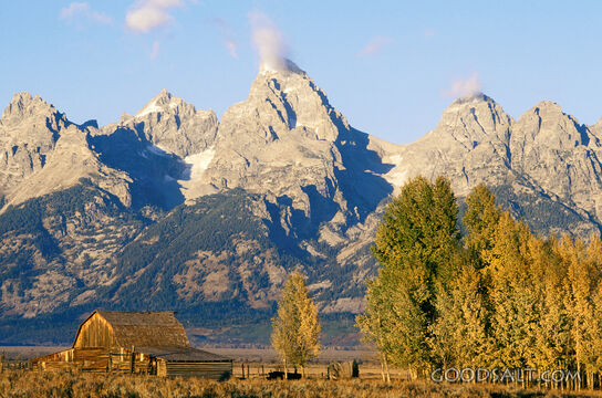 Barn With Trees, Mountains, and Clouds
