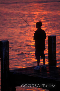 Boy Fishing at Sunset