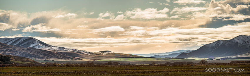 Bright valley with ground snow.
