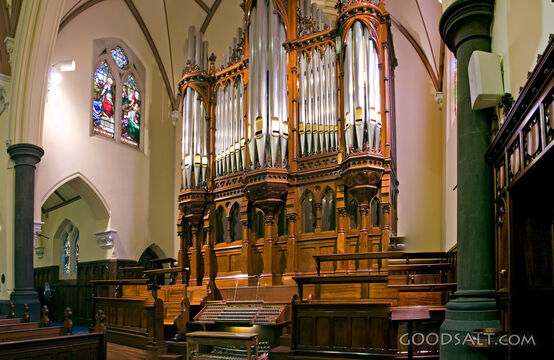 Church Interior With Seats and Pipe Organ