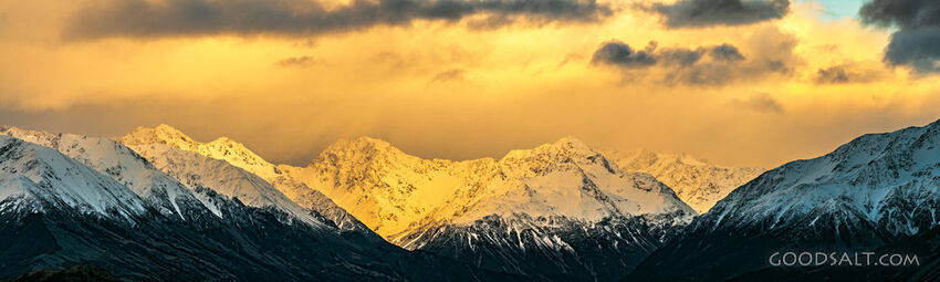 Close detail of mountainside immersed in golden morning sunlight.