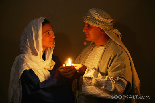 Couple Holding Lamp Together