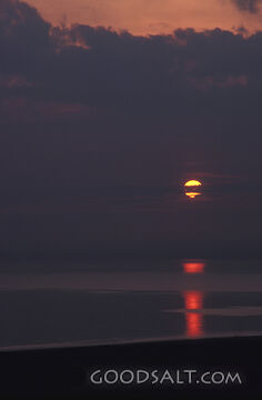 Dark Clouds at Sunset With Reflection