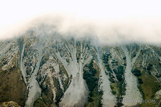 detail of cloud-engulfed snowy mountainside.