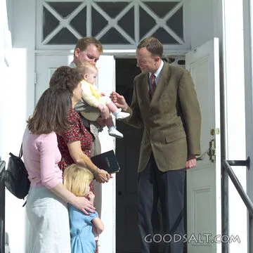 Pastor Welcoming a Family to Church
