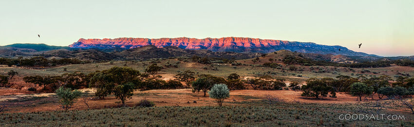 evening sun lighting up desert rock escarpments.