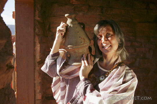 woman with clay picture on shoulder, close up