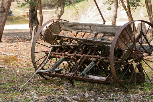 Historic farm machinery in paddock..