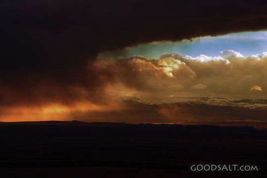 IDAHO. Boise. Storm clouds at sunset over Boise foothills fr